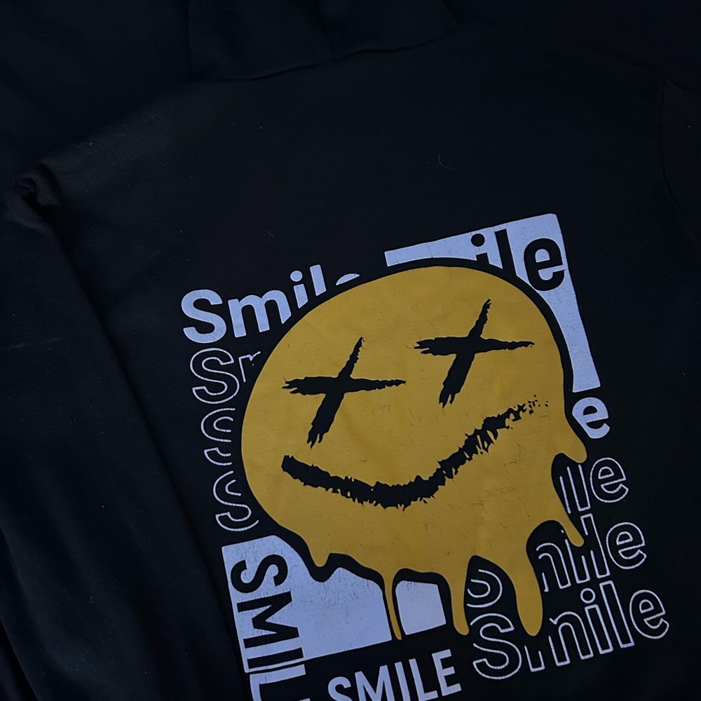 Black Hoodie with Yellow Smiley Graphic